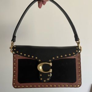 Coach bag (I forgot the name but I think it’s in the tabby family)